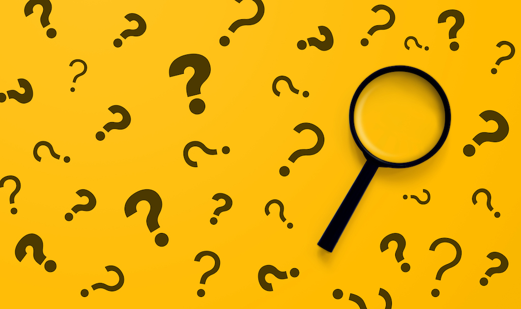 Yellow background with question marks and magnifying glass representing questions about heating and AC repair.
